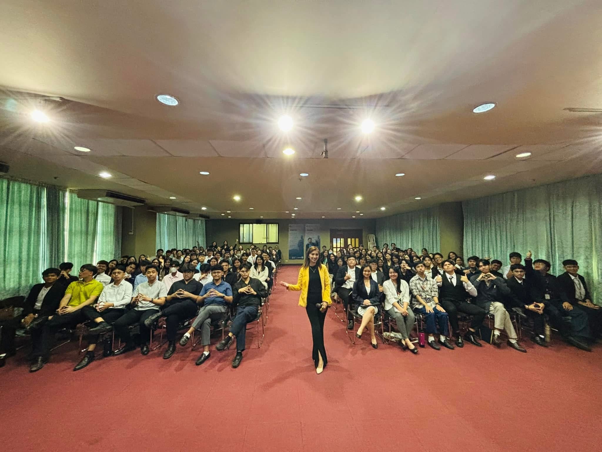 A RIPE facilitator addressing a full auditorium